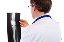 Photo of doctor looking at X-ray